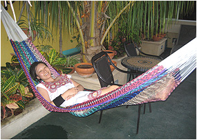 me in my native huipil dress in a handmade yucatecan hammock